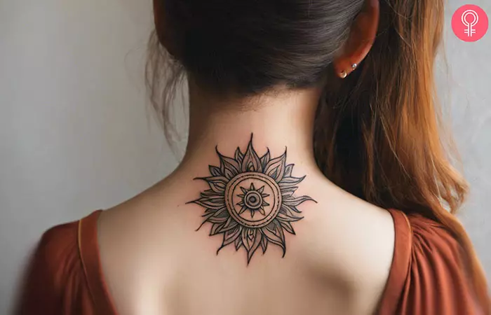 Sun tattoo on the back of the neck