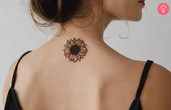 Sunflower tattoo on the back of the neck