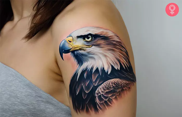 Super realistic eagle tattoo on the arm of a woman