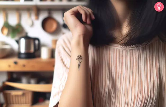 A tiny daffodil tattoo on the wrist