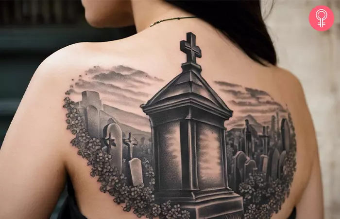 A tombstone cemetery tattoo on the back