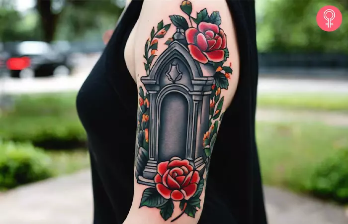A woman with a traditional tombstone tattoo on her forearm