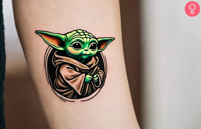 Traditional Yoda tattoo on the lower arm