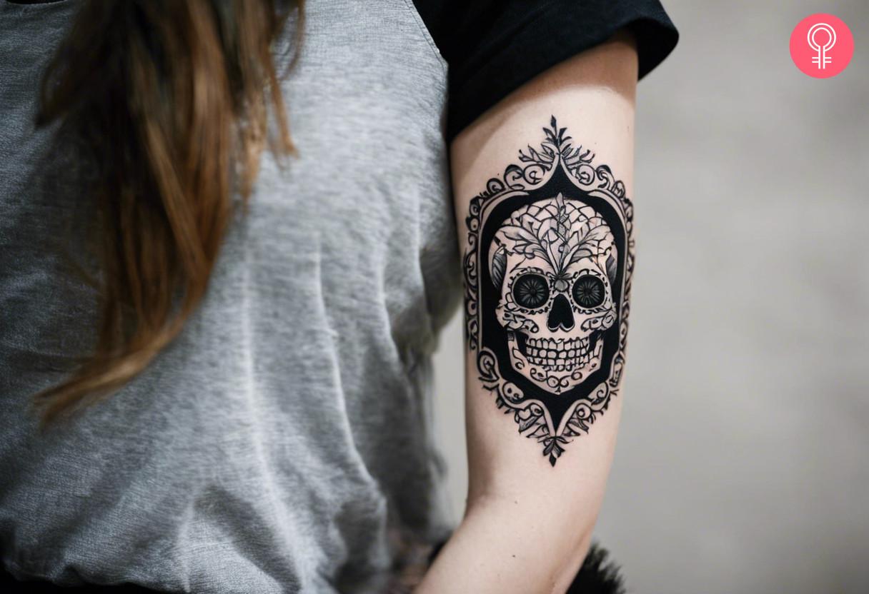 Traditional blackwork skull tattoo on arm