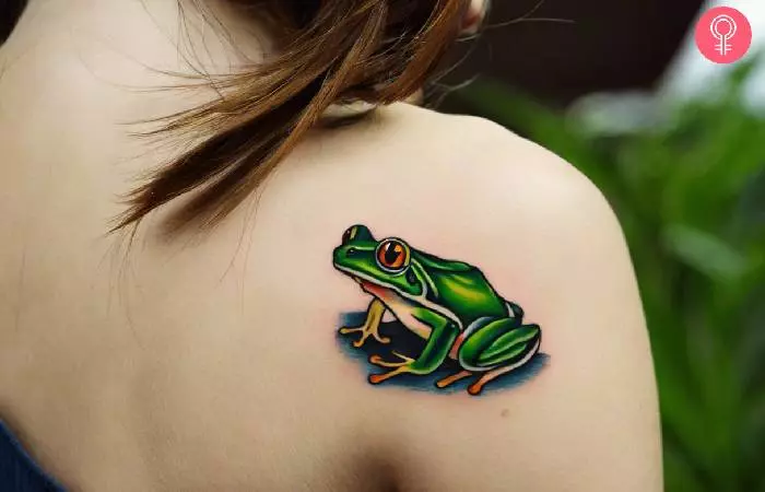Traditional frog tattoo on a woman’s shoulder