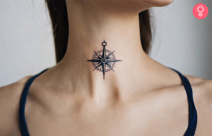 Travel tattoo of a sailor’s compass on a woman’s neck