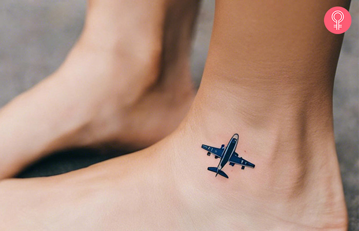 Travel tattoo of a tiny airplane on a girl’s foot