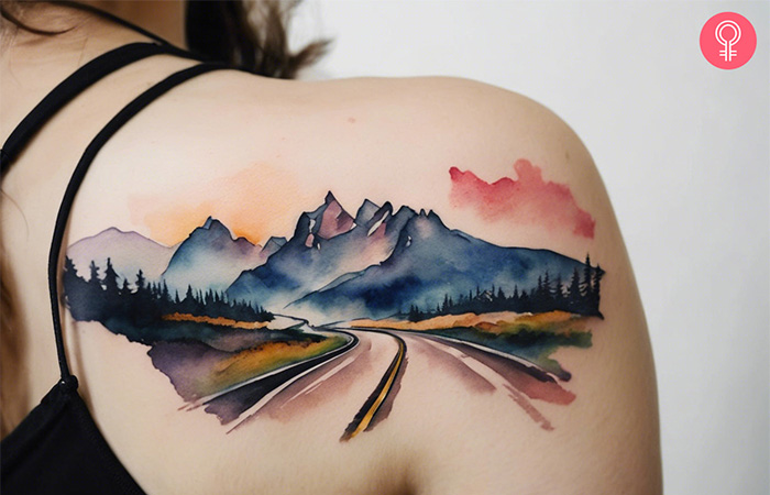 Travel tattoo of landscape with mountains and a road