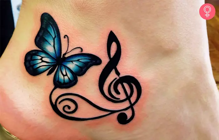 Woman with a treble clef butterfly tattoo on her ankle