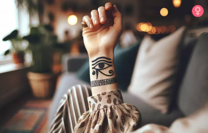 A tribal eye of Horus tattoo design on the wrist