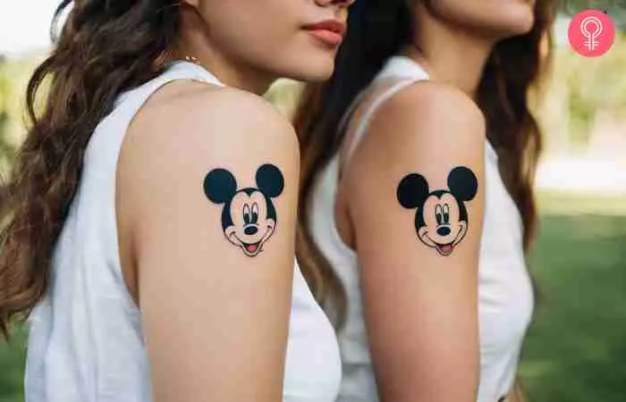 Two friends sporting matching Disney friendship tattoos