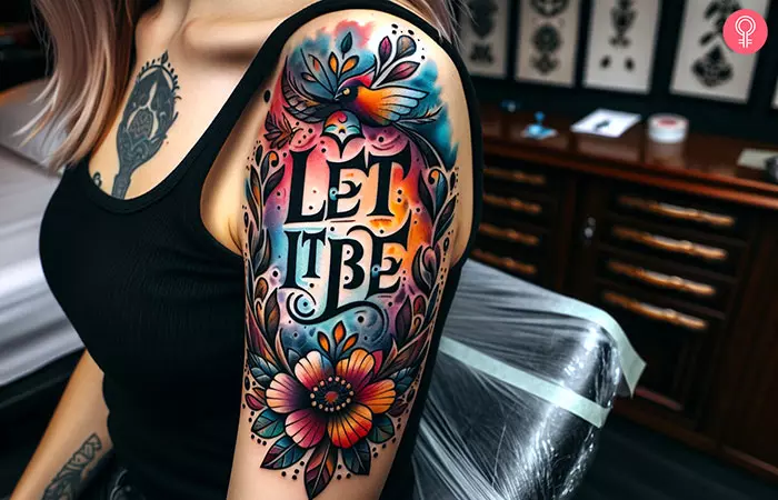 A let it be watercolor tattoo on the upper arm