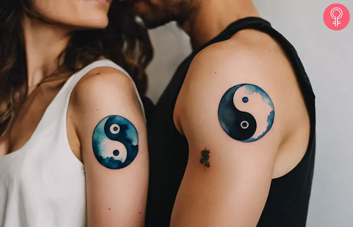 Yin yang couple tattoos on the upper arm