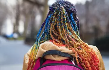 Woman flaunting chunky yarn hair wrapped braids
