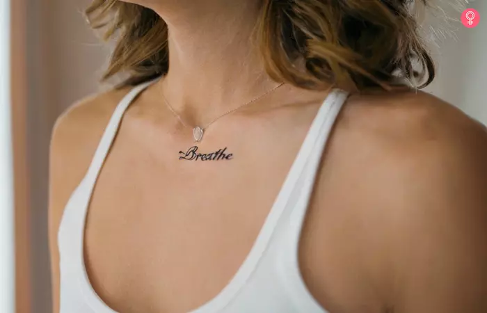 Woman with a ‘Breathe’ tattoo below her neck