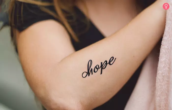 Woman with a ‘Hope’ tattoo on her forearm