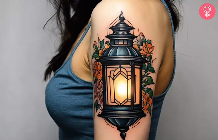 Woman with a traditional lantern tattoo on the upper arm