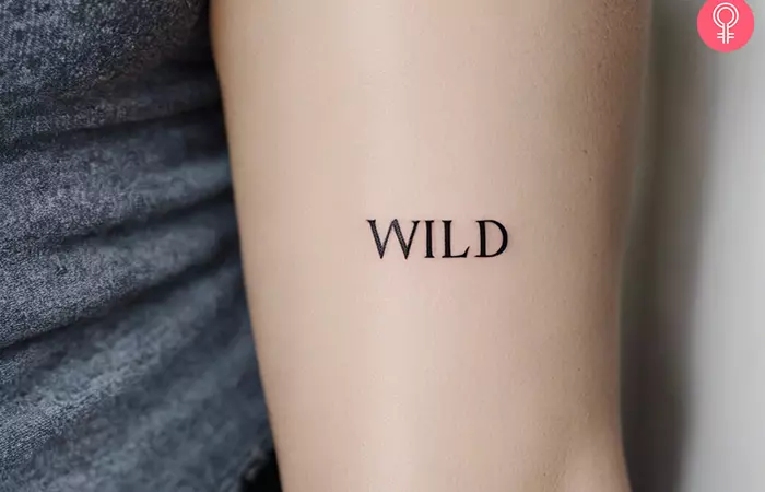 Woman with the word ‘Wild’ tattooed on her upper arm