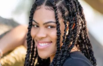Women wearing a soft locs and faux locs hairstyles