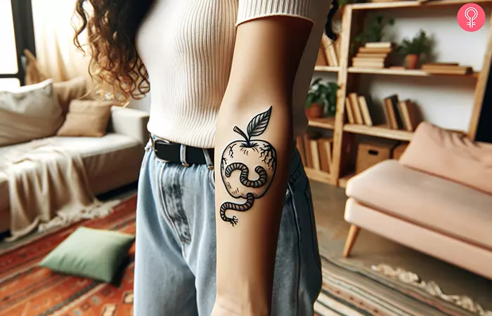 Worms coming out of an apple tattoo