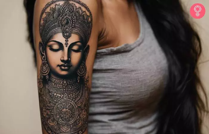 man with a Hindu tattoo quarter sleeve on her upper arm