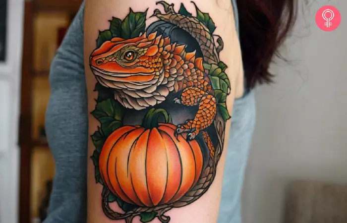 man with a halloween-themed bearded dragon tattoo on his arm
