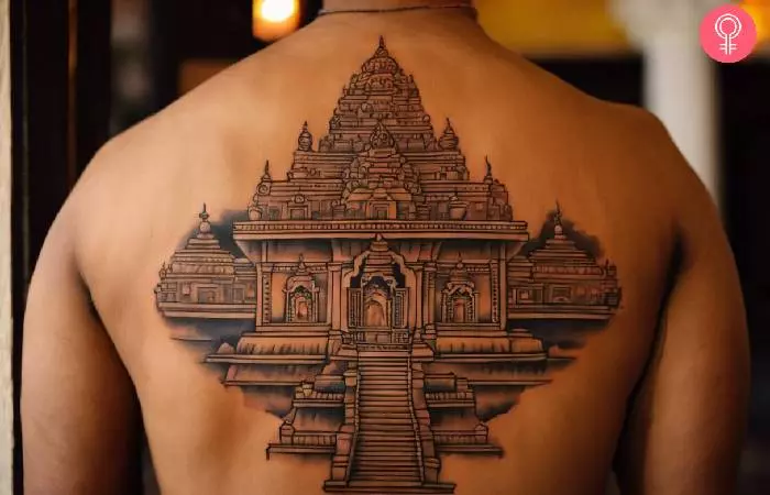 man with a traditional Hindu tattoo on his upper back