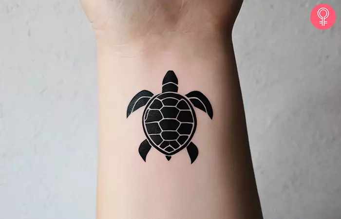 simple turtle tattoo on the wrist