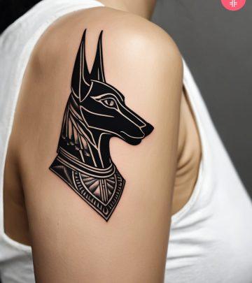 A woman with an Anubis tattoo on her shoulder