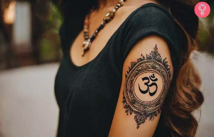 woman with a Hindu tattoo for females on her arm