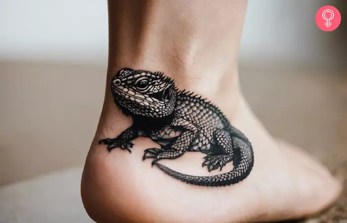 woman with a bearded dragon foot tattoo
