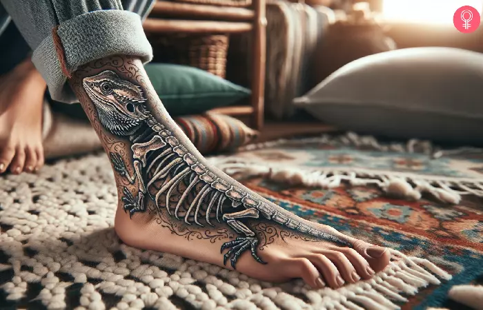 woman with a bearded dragon skeleton tattoo on her ankle