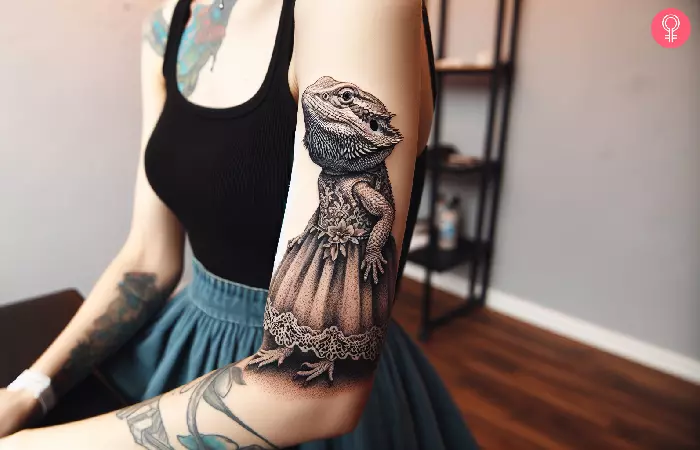 woman with a funny bearded dragon tattoo on her arm