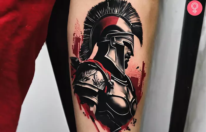 A 300 Spartan tattoo on the forearm