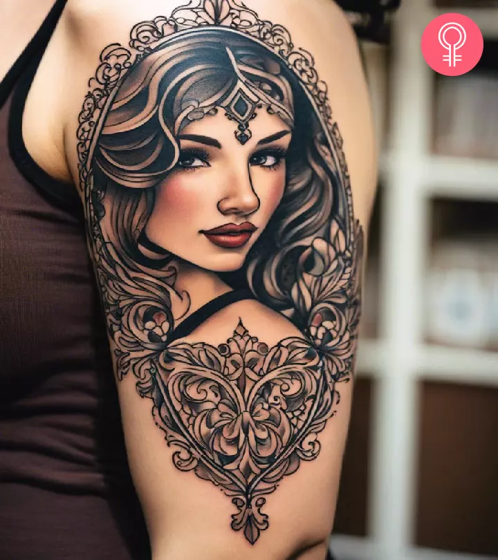 A woman with a filigree tattoo on her upper arm