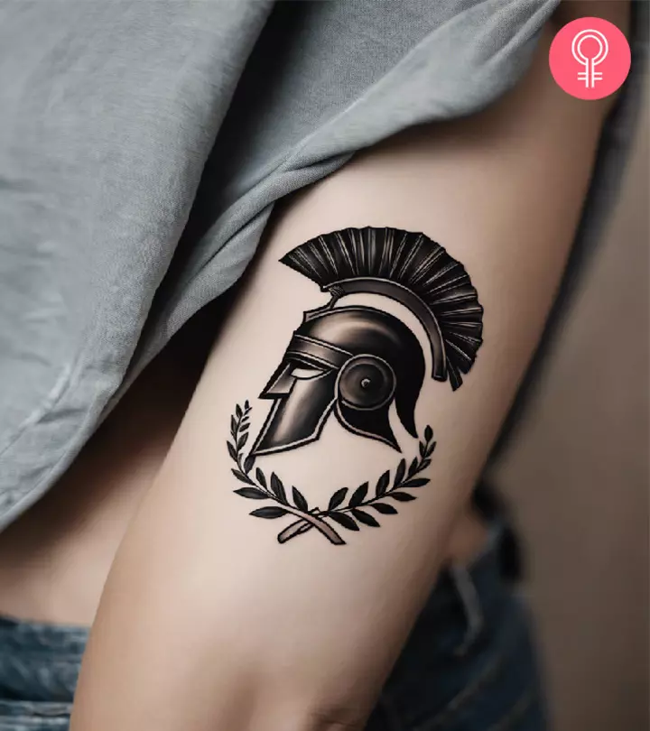 A spartan tattoo on the upper arm