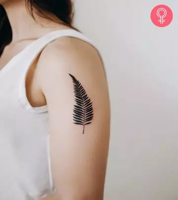 A woman with a leaf tattoo on her arm