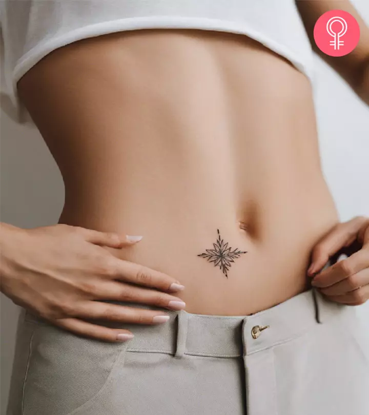 A woman with a minimalist stomach tattoo
