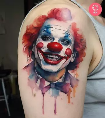 Woman with a joker tattoo on the lower arm