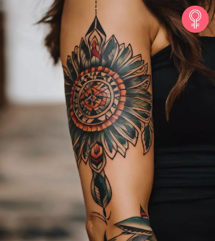 A Native American tattoo on the arm of a woman