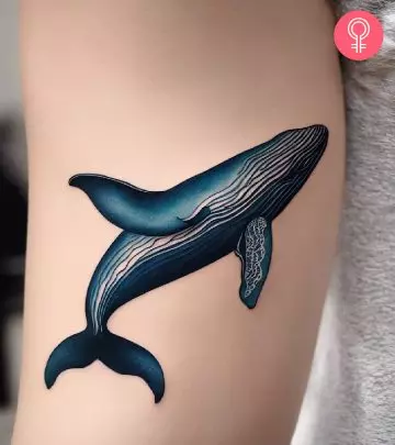 A woman with a coral reef tattoo on her arm