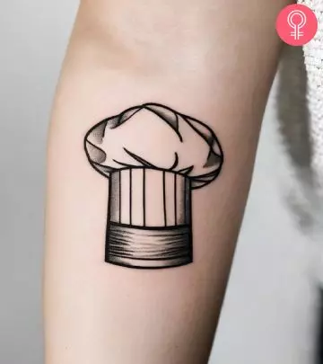 Chef knife tattoo on the arm of a woman