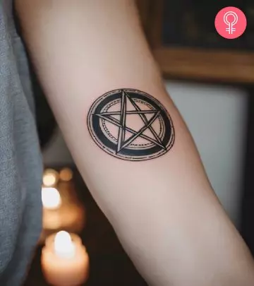 Demon tattoo on the arm