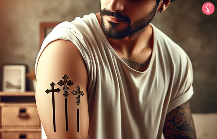 A 3-cross tattoo on the arm of a man