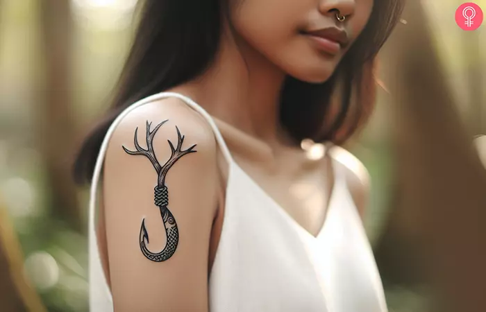 A Hawaiian fish hook tattoo on the arm