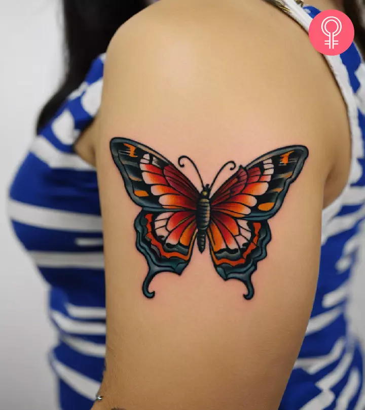 A butterfly tattoo on a woman’s arm