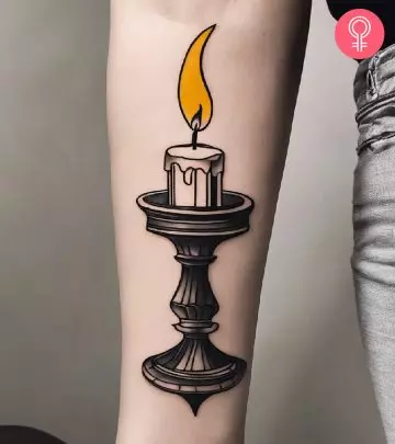 A candle tattoo on the arm