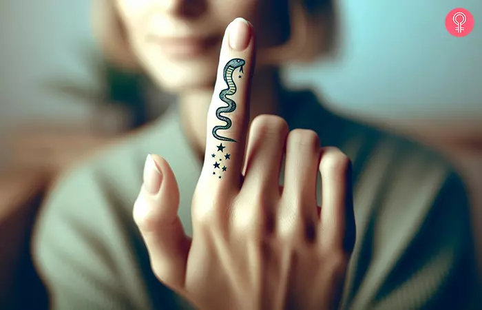 A cobra custom tattoo on the index finger