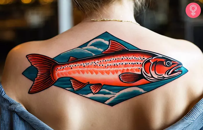 A colorful salmon fish tattooed on the upper back