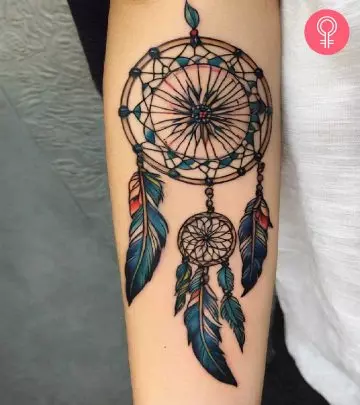 A dreamcatcher tattoo on the arm